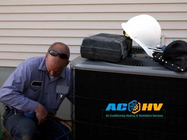 HVAC technician working on air conditioning unit